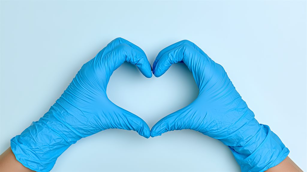 Gloved hands forming a heart for cardiology services